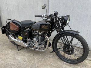 a black 013 velocette kss350 07 motorcycle parked on concrete